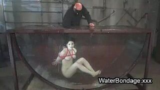Brunette in rope bondage dive in water - porn video