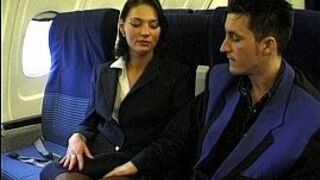 Brunette beauty wearing stewardess uniform gets fucked on a plane - porn video